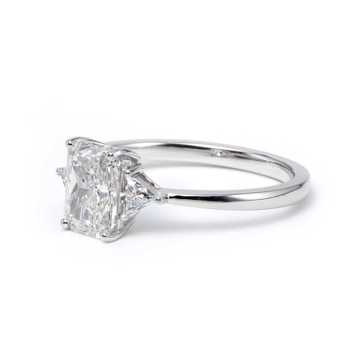 14K White Gold 1.5ct Radiant Cut Lab Diamond Three Stone Ring with Triangular Cut Lab Diamond Side Stones and Tapered Band Design - FIORESE JEWELRY
