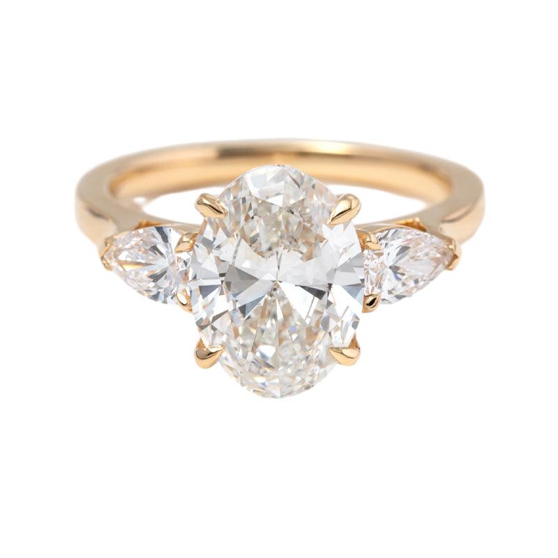 3 CT Oval Cut Lab Diamond 4 - Claw Floral Basket Three - Stone Ring with Pear Side Stones - FIORESE JEWELRY