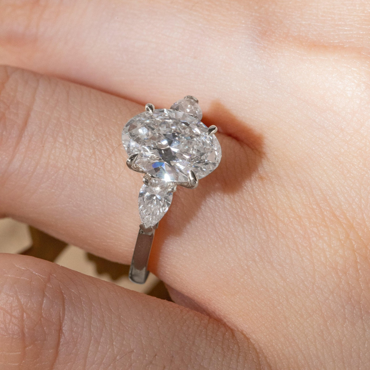 3 CT Oval Cut Lab Diamond 4 - Claw Floral Basket Three - Stone Ring with Pear Side Stones - FIORESE JEWELRY