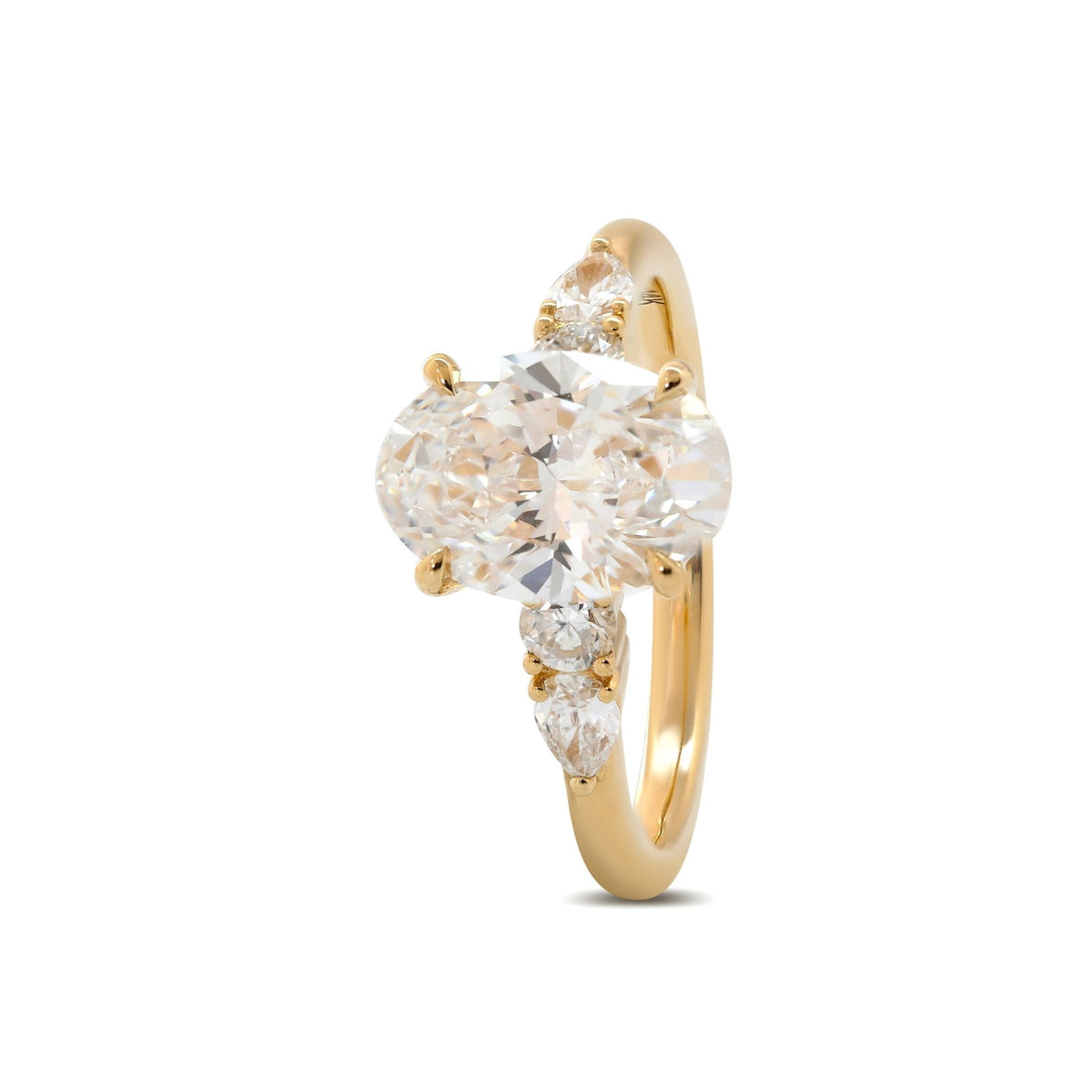 Oval Lab Diamond Ring with Four - Claw Prong Basket Setting and Round and Pear Lab Diamond Side Stones - FIORESE JEWELRY