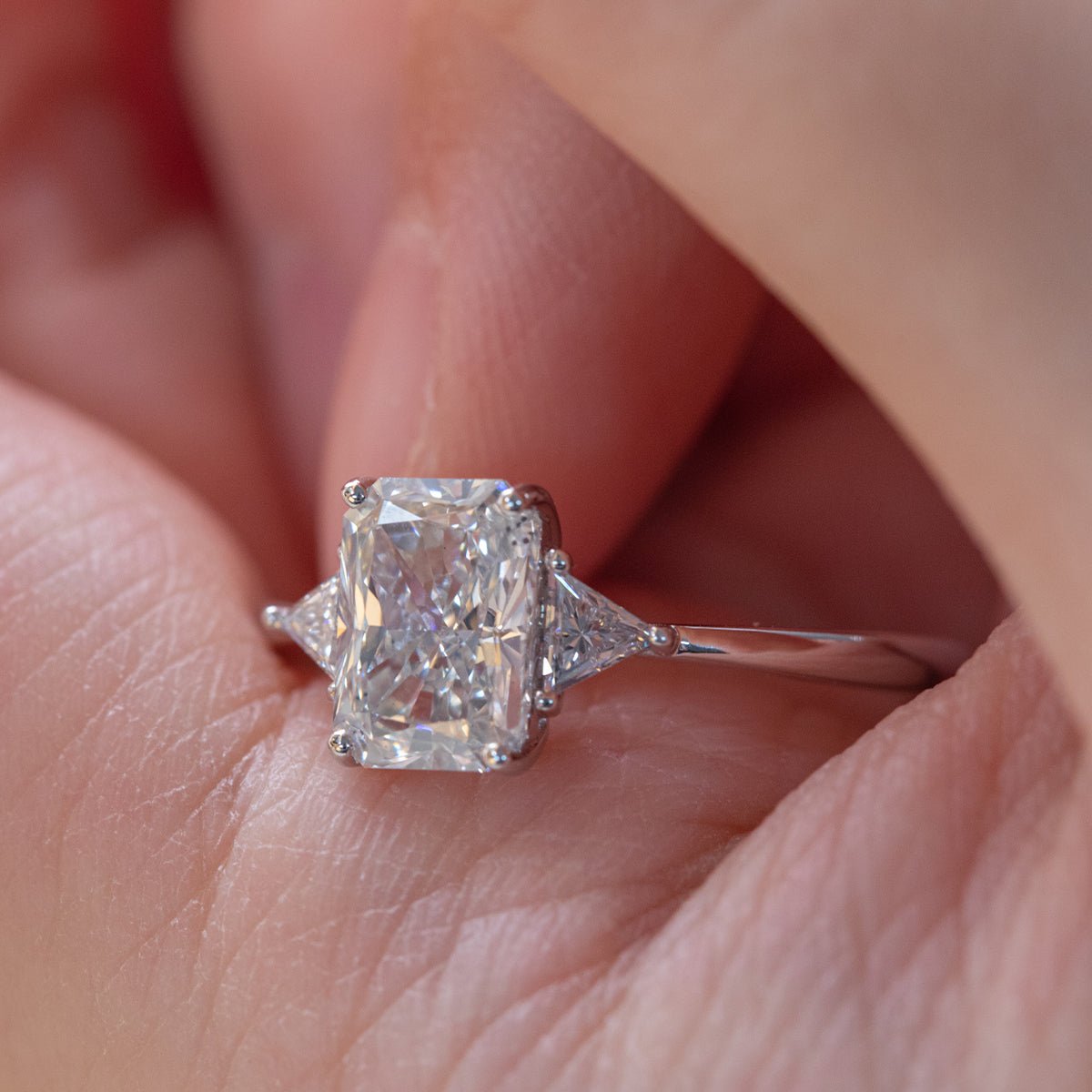 14K White Gold 1.5ct Radiant Cut Lab Diamond Three Stone Ring with Triangular Cut Lab Diamond Side Stones and Tapered Band Design - FIORESE JEWELRY